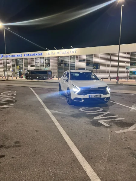 White Kia Sportage automatic 4x4 SUV at Kefalonia Airport, opposite three-quarter view