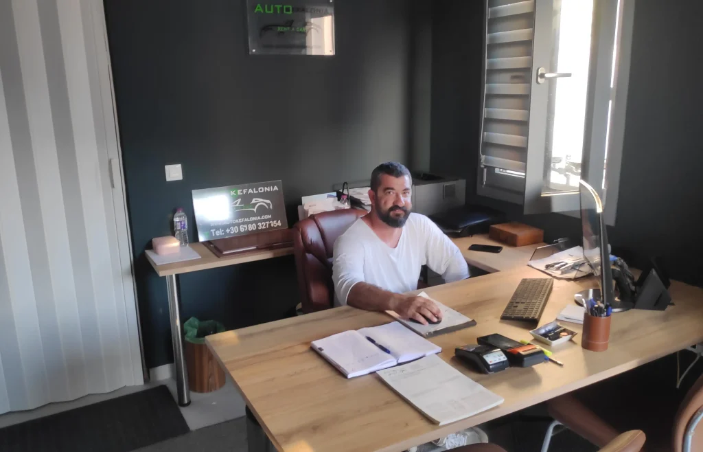 Giorgos Kaliviotis in AutoKefalonia car rental office in Metaxata